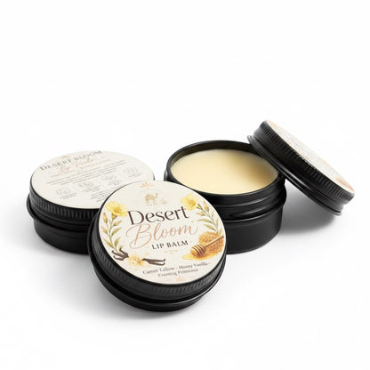 The Beef Bus Desert Bloom camel suet tallow lip balm in black tins with honey vanilla and evening primrose labels.